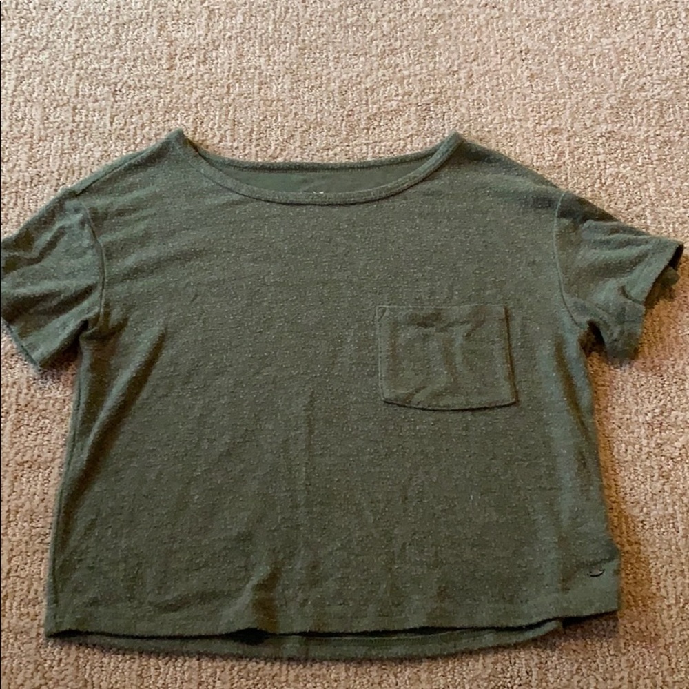 green shortsleeved top